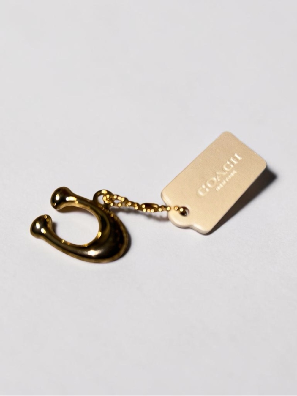Coach Gold Horseshoe Charm Keychain with hang tag